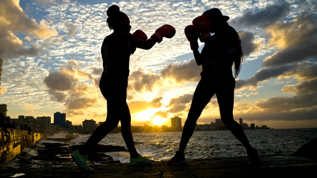 Idamelys Moreno, left, and Legnis Cala are part of a group of up-and-coming female boxers on the island who want government support to form Cuba's first female boxing team.