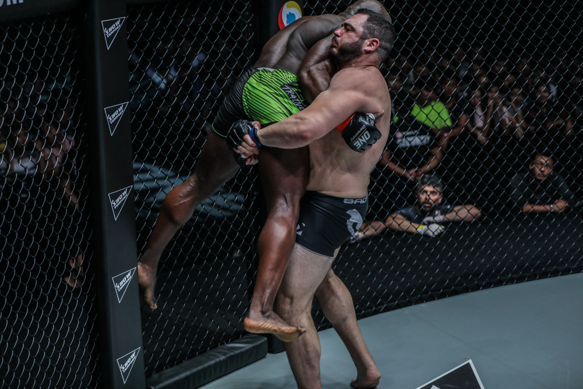Mauro "the Hammer" cerilli grapples with Alain "The Panther" Ngalani at ONE: REIGN OF VALOR