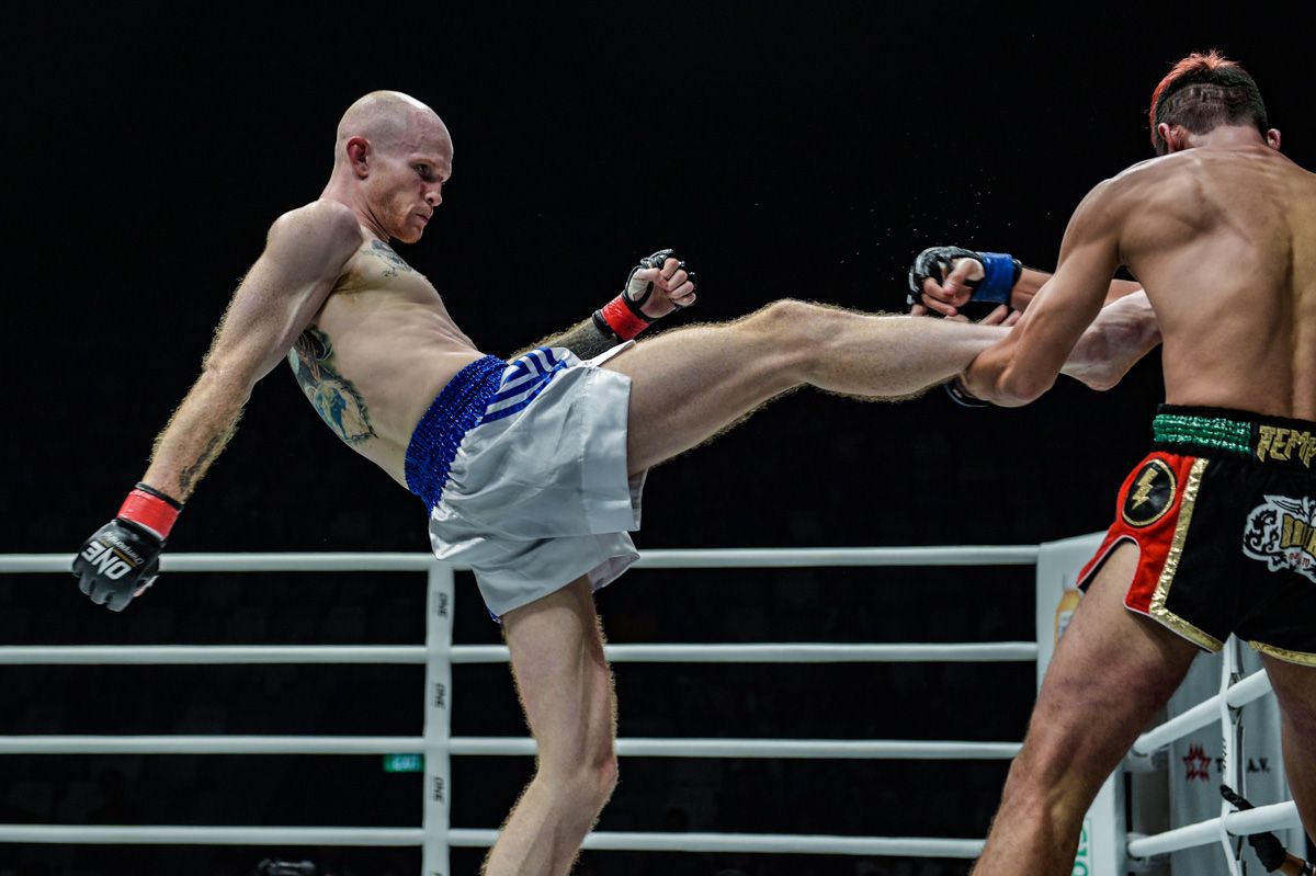 Andrew Miller attacks Mohammed "Jordan Boy" Bin Mahmoud in a Muay Thai bout at ONE: FOR HONOR