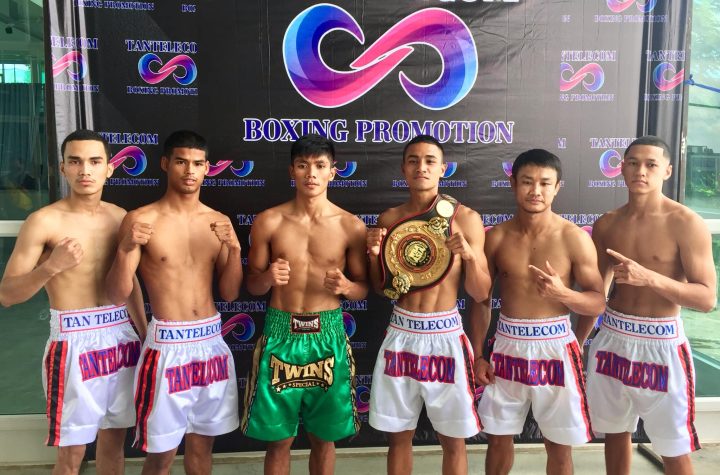 Filipino Adrián Adrian Sales Lerasan (wearing green trunks) poses with opponent WBA Asia 115lbs Champion Nattapong Jankaew and the four other boxers scheduled to see action in the 3-fight card unfolding on Friday, Aug 19, at Lake Event & Studio in Bangkok, Thailand. The show will be live online at the official site or PPTV Channel 36.
